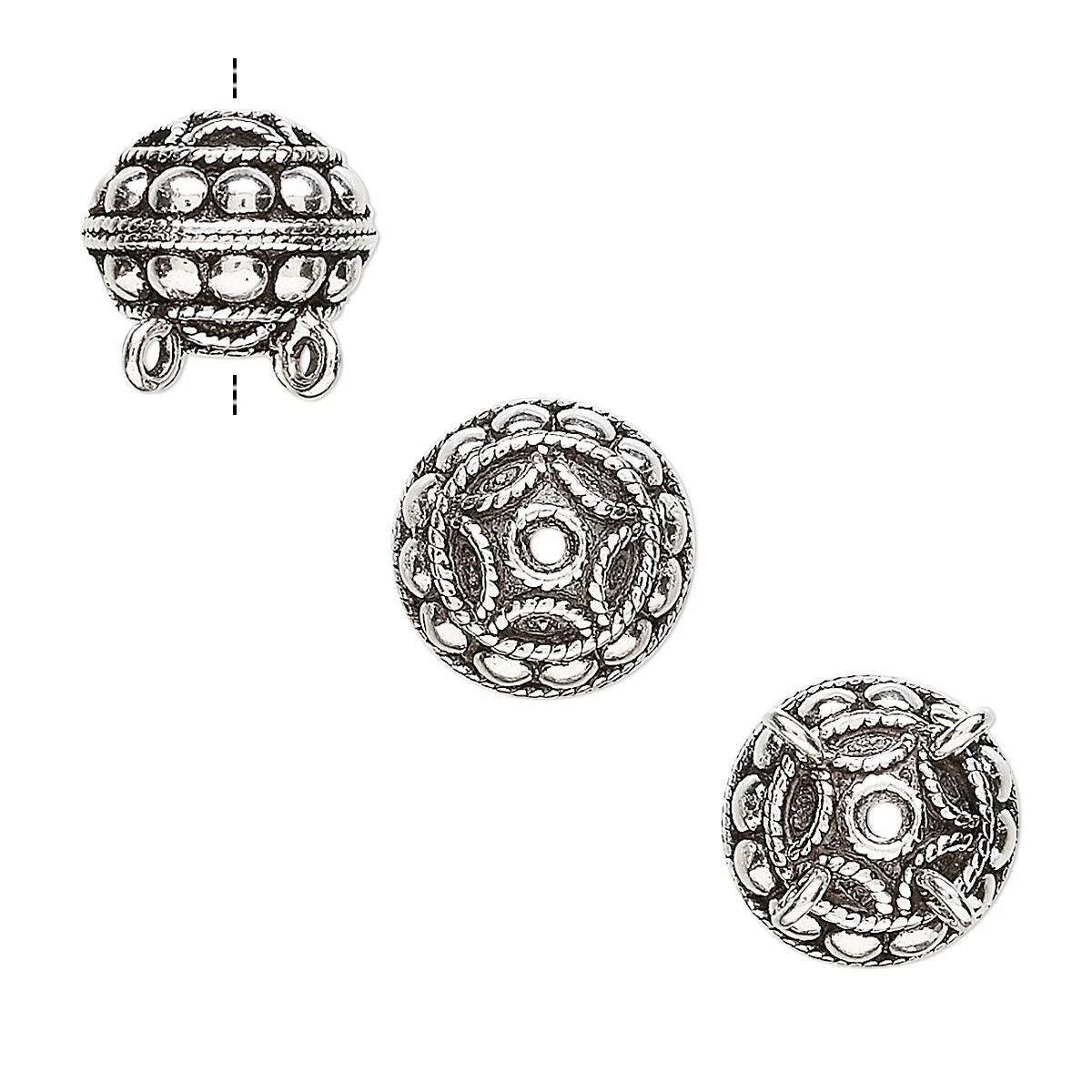 Three views of an ornate silver-toned round bead with intricate filigree cutouts and hanging loops, shown on a plain white background.