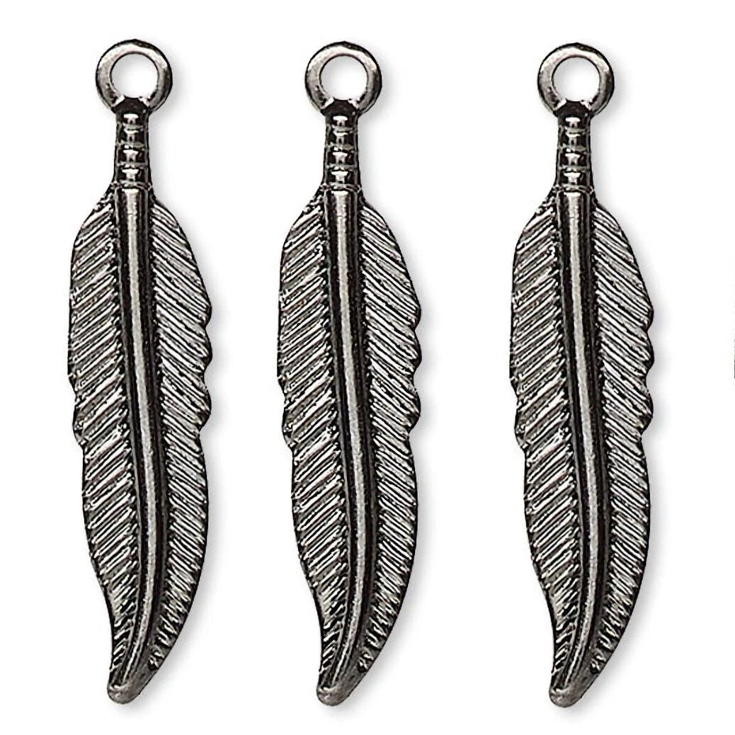 Four silver-toned metal feather charms with hanging loops, arranged side by side on a plain white background.