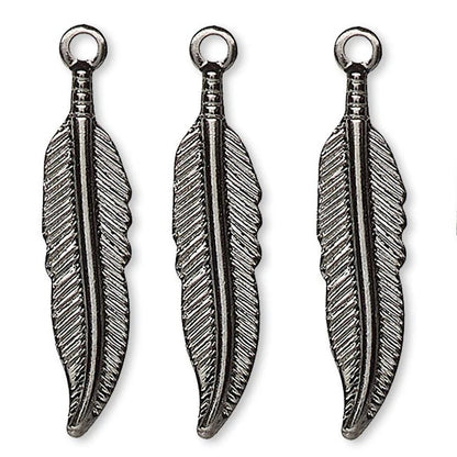Four silver-toned metal feather charms with hanging loops, arranged side by side on a plain white background.