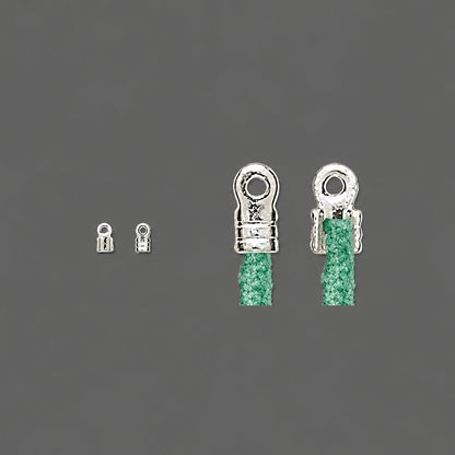 Two silver-toned metal lobster claw clasps shown on a dark gray background, with green braided cord threaded through the larger clasps.