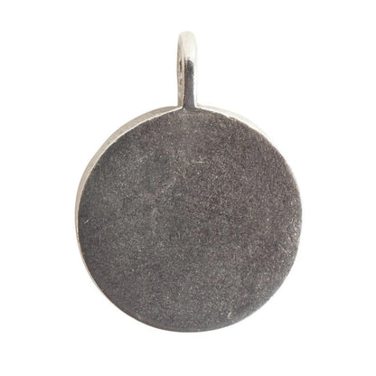 A round, flat silver pendant with a textured, hammered finish and a small integrated loop at the top, shown on a plain white background.
