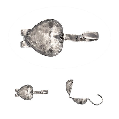 A silver-toned metal heart-shaped mouth gag with a textured, hammered finish, shown in three views: a close-up of the main heart, a side profile, and an open view showing the hook end.