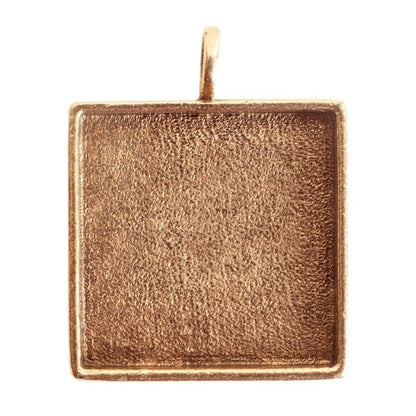 A square textured metal pendant with a warm rose gold or coppery-gold finish, featuring a small top loop, shown on a plain white background.