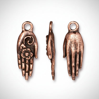 Three views of a copper Hamsa hand charm pendant on a white background, showing the front, side, and back details.