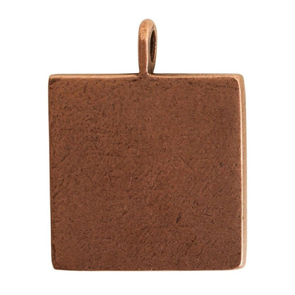 A square textured metal pendant charm with a top loop, shown on a plain white background.