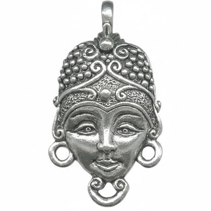 An ornate silver pendant featuring a stylized face with detailed filigree patterns, circular earrings, and a top bail, shown on a plain white background.