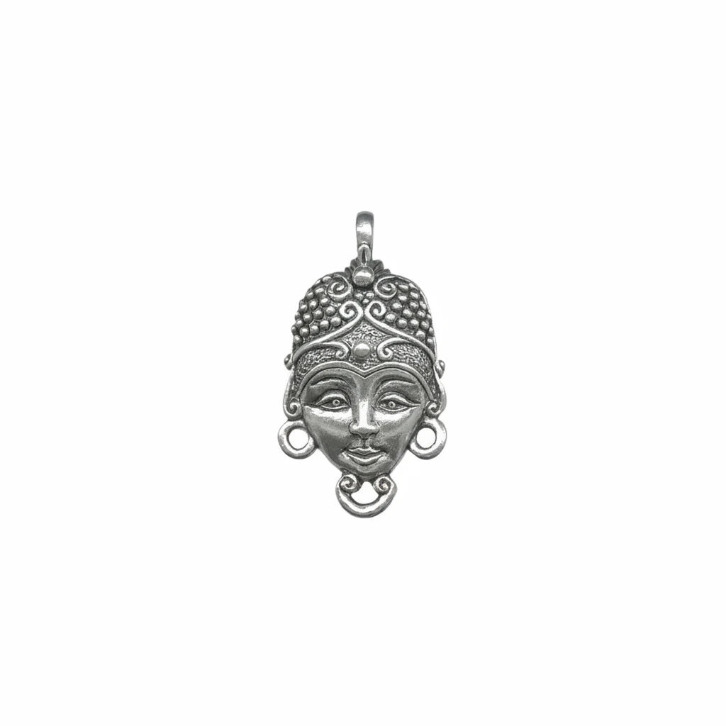 An ornate sterling silver pendant featuring a stylized face with a detailed headdress, circular earrings, and a hanging loop at the top, shown against a plain white background.