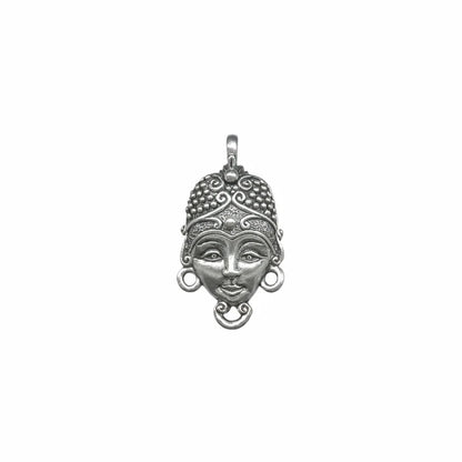 An ornate sterling silver pendant featuring a stylized face with a detailed headdress, circular earrings, and a hanging loop at the top, shown against a plain white background.