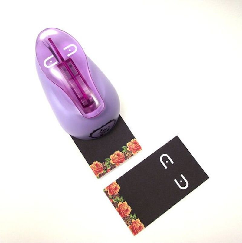 Purple stamp with floral design on black paper