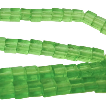 Green translucent rectangular faceted beads strung on cords, shown in multiple strands against a plain white background.