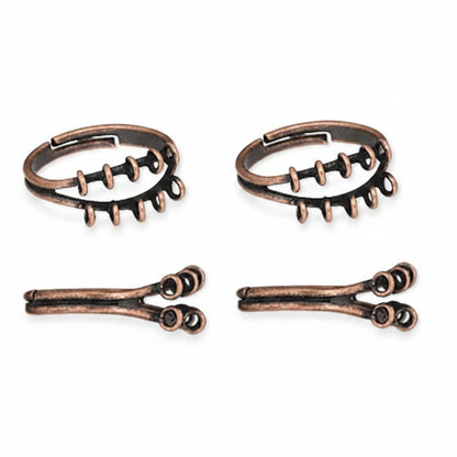 Four antique bronze spiral ear cuffs arranged in two pairs on a plain white background.