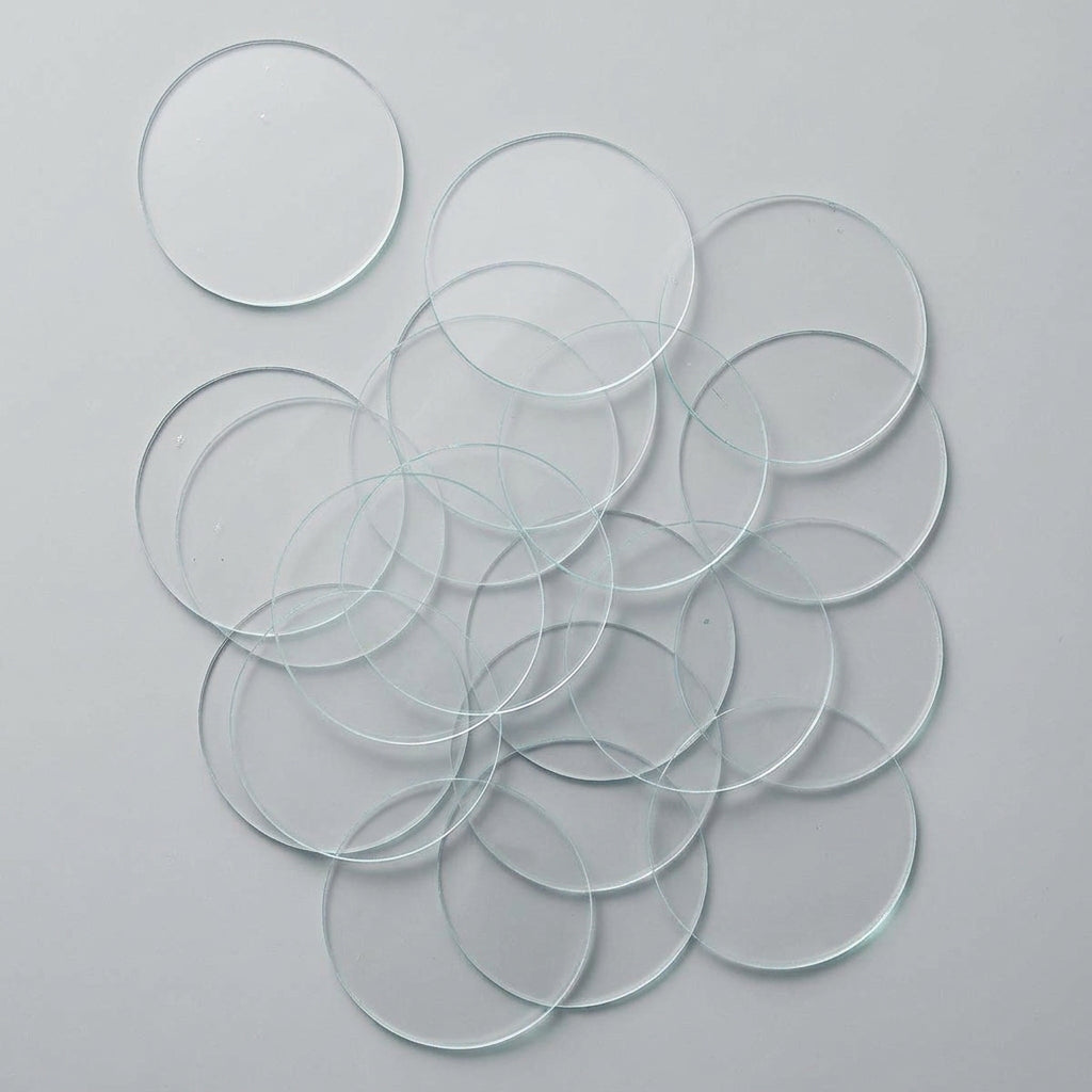 Multiple clear GLASS SLIDE discs on a white background