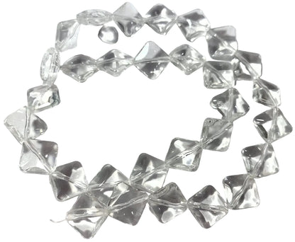 A strand of clear, faceted glass beads arranged in a circle on a white surface, with a US quarter coin placed in the center for scale.