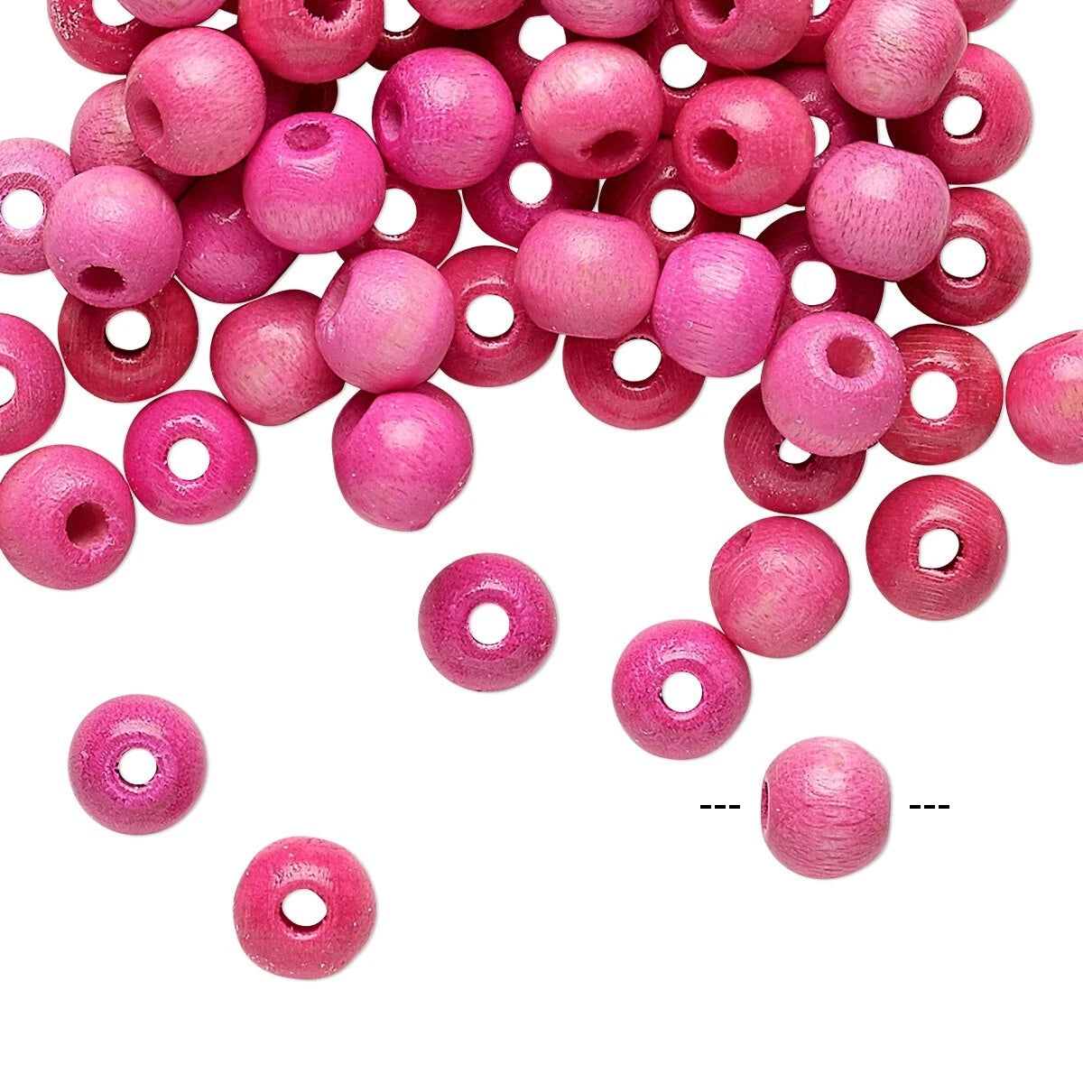 Pink wooden beads with drilled holes, scattered on a white background with a few beads floating separately near the bottom.