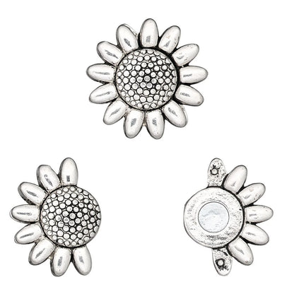 Three views of a silver-toned sunflower-shaped jewelry finding or charm on a plain white background, showing the front textured face, the back with a circular recess, and a side profile.