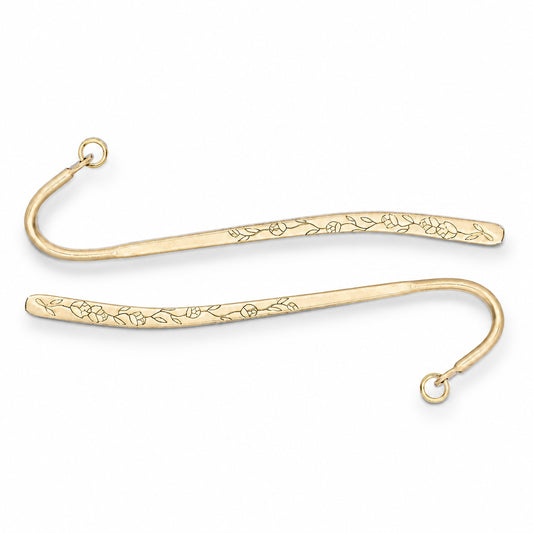 Two gold metal bookmark hooks with engraved floral patterns, shown on a plain white background.