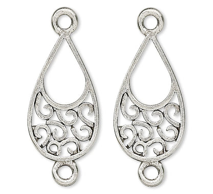 A pair of silver teardrop-shaped filigree charms with decorative scrollwork and circular loops at the top and bottom, shown on a plain white background.