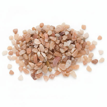 Close-up of small pebbles in various shades of brown and beige on a white background