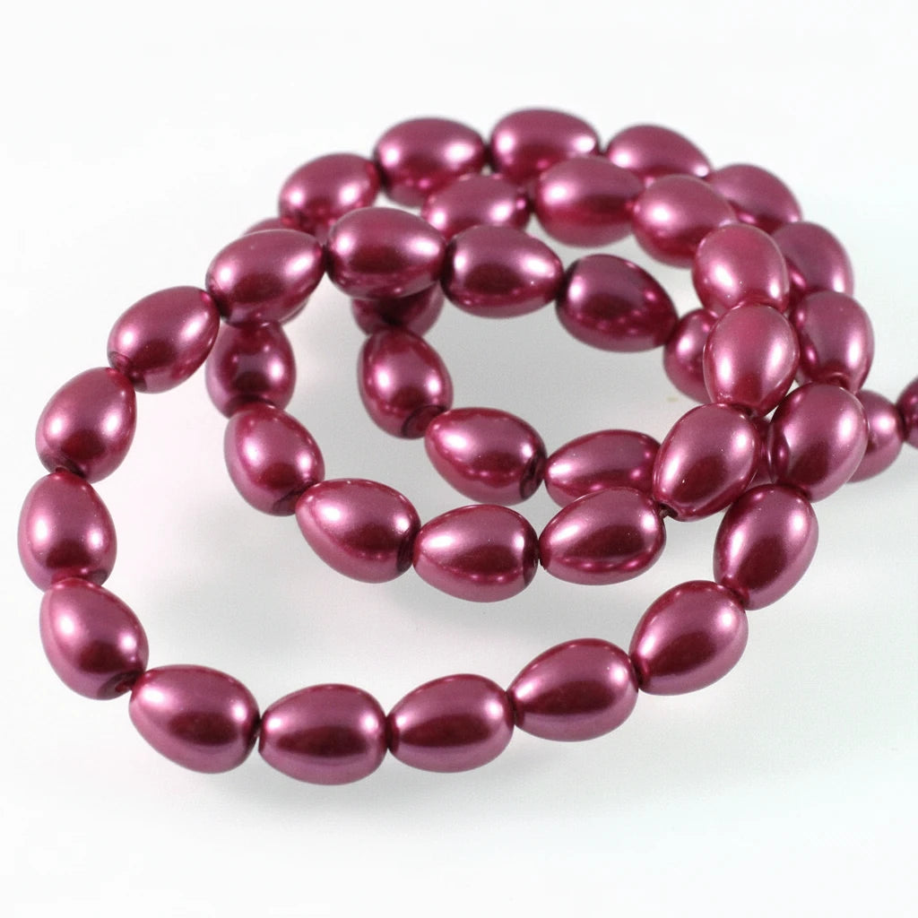 A strand of glossy, metallic plum purple beads arranged in loops on a plain white background.