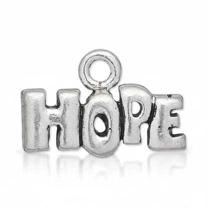 A silver-toned metal charm spelling the word 'HOPE' in block letters, with a loop at the top for attachment, shown on a plain white background.