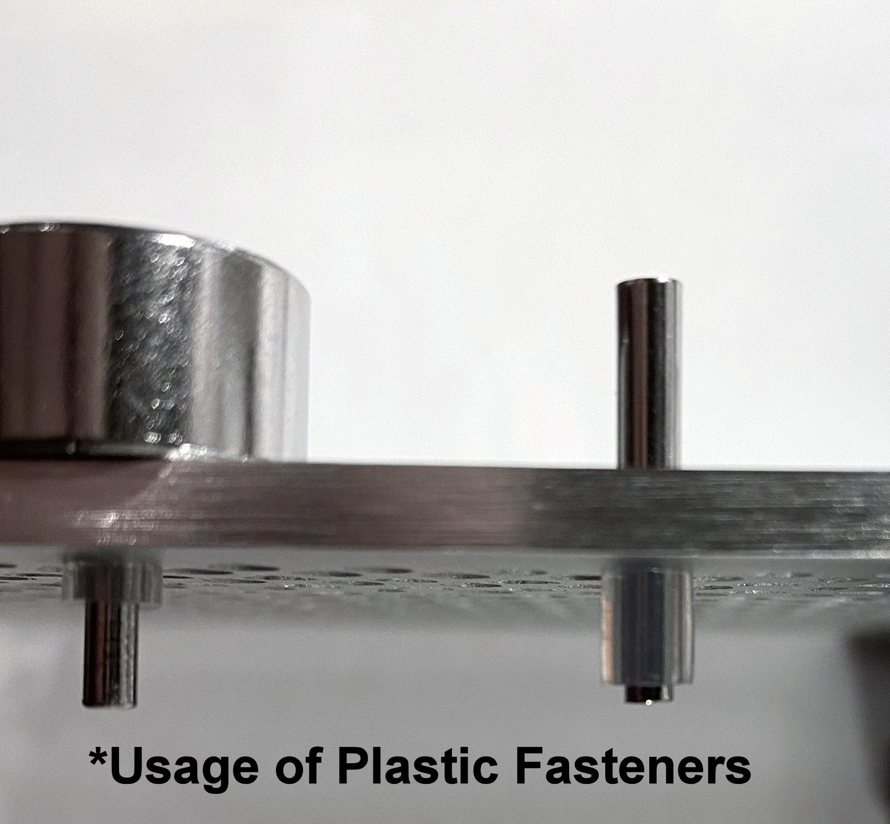 Metallic fastener with plastic fasteners on a white background
