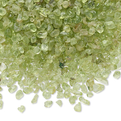 Close-up of green gemstones on a white background