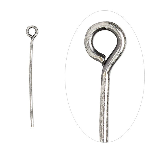 A silver-toned metal loop pin shown on a white background, with a smaller full-length view on the left and a larger close-up inside an oval on the right.