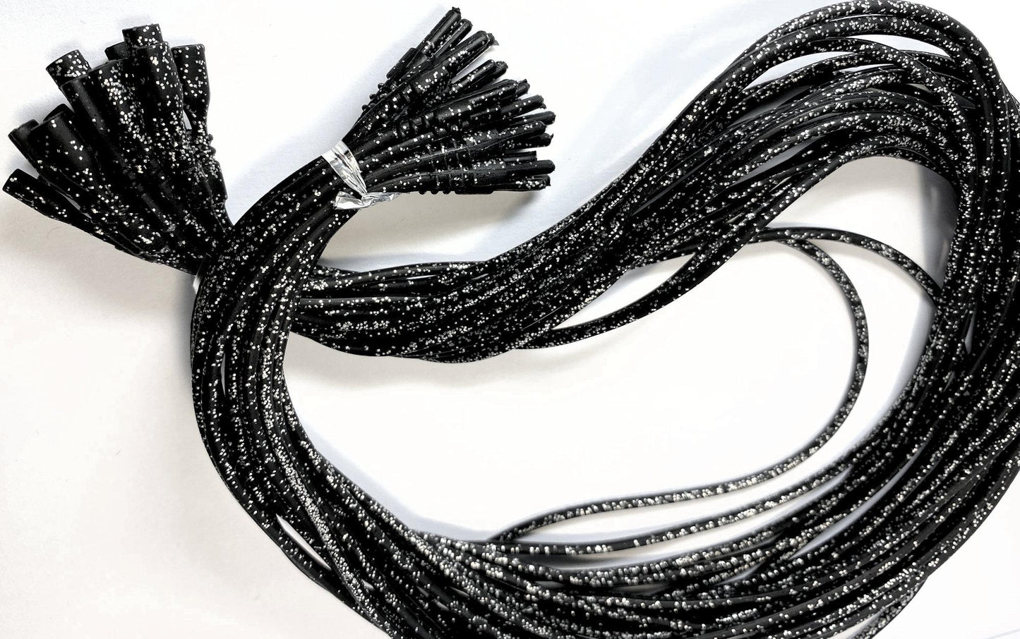 Black braided cords on a white background