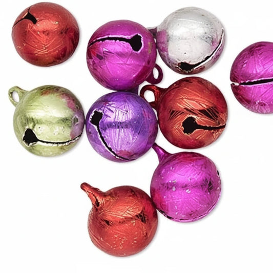 A group of small metallic Christmas jingle bells in assorted colors including red, purple, pink, green, silver, and orange, arranged on a plain white background.