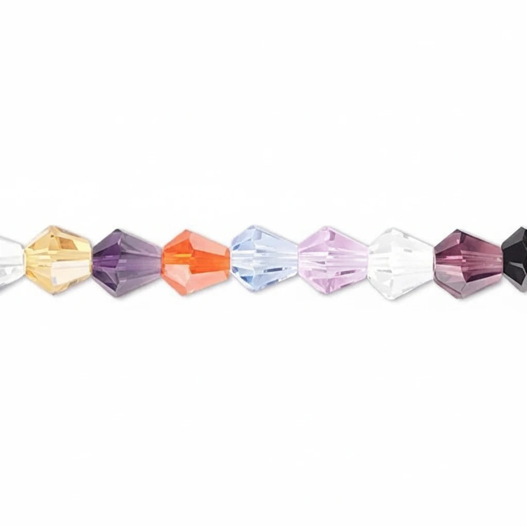 A close-up horizontal line of faceted crystal beads in assorted colors including yellow, purple, orange, light blue, lavender, white, and dark purple, set against a plain white background.