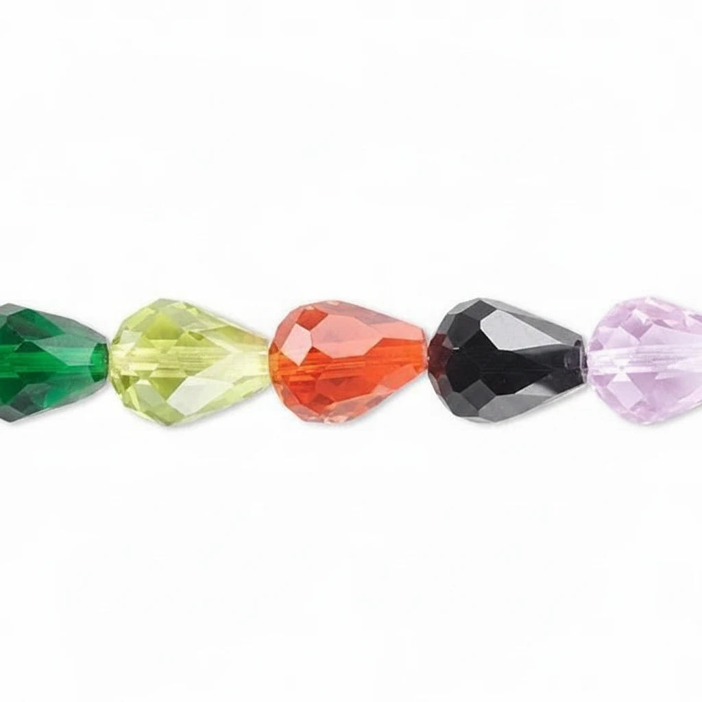 Faceted teardrop-shaped beads in a row, shown in green, yellow-green, orange-red, black, and light purple on a white background.