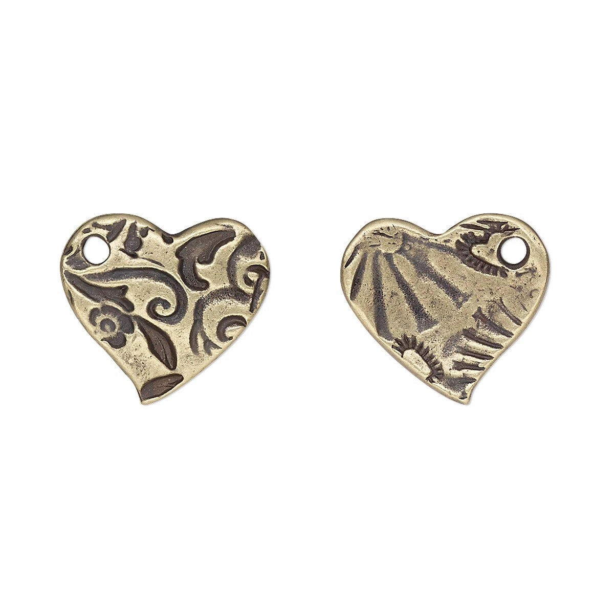 Two antique bronze heart-shaped metal charms with engraved floral and sunburst patterns, each featuring a small loop at the top, shown on a plain white background.