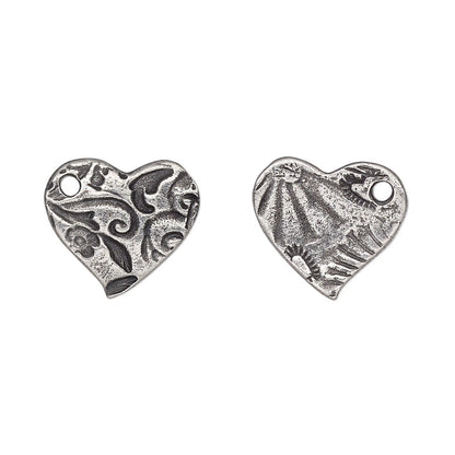 Two silver heart-shaped charms with textured, antiqued finishes and small hanging loops, displayed side by side on a plain white background.