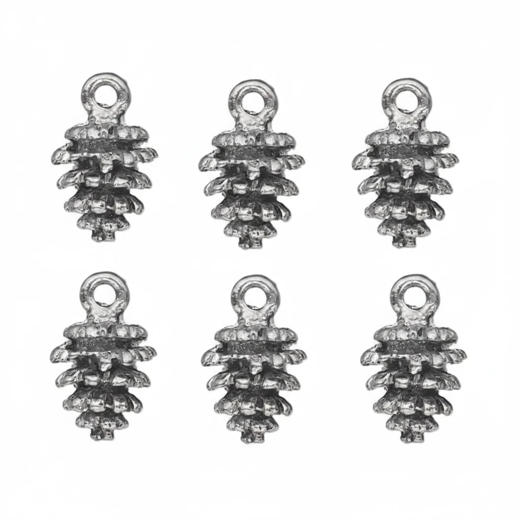 silver pine cone charms with a textured, antiqued finish, arranged on a plain white background.