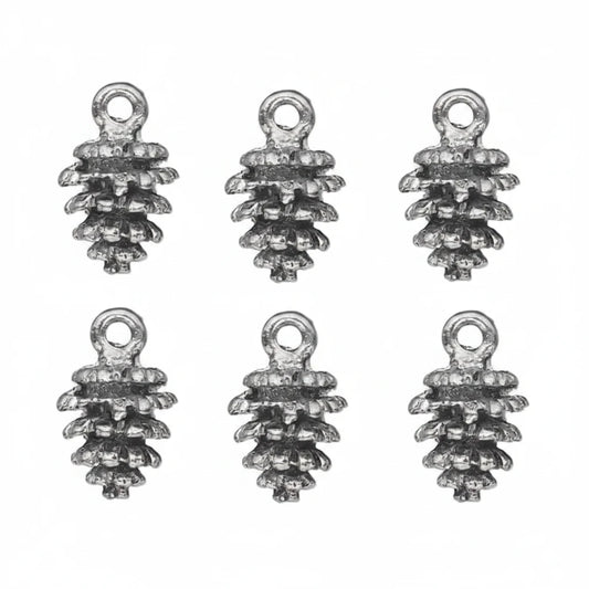 silver pine cone charms with a textured, antiqued finish, arranged on a plain white background.