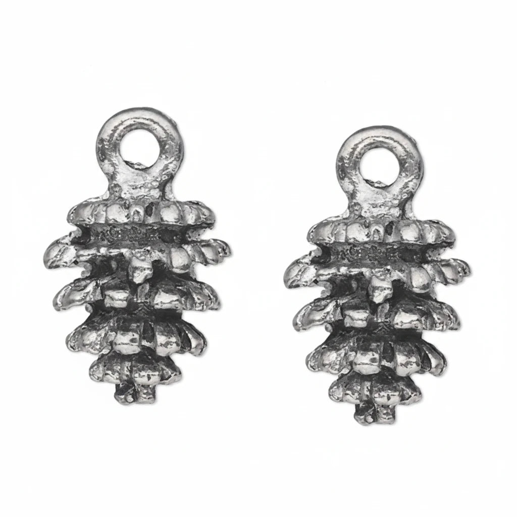 Two small metallic pinecone-shaped charms with loop tops, shown side by side on a plain white background.