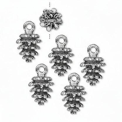 Five silver pine cone charms with hanging loops, arranged on a plain white background, with one additional charm shown above them.