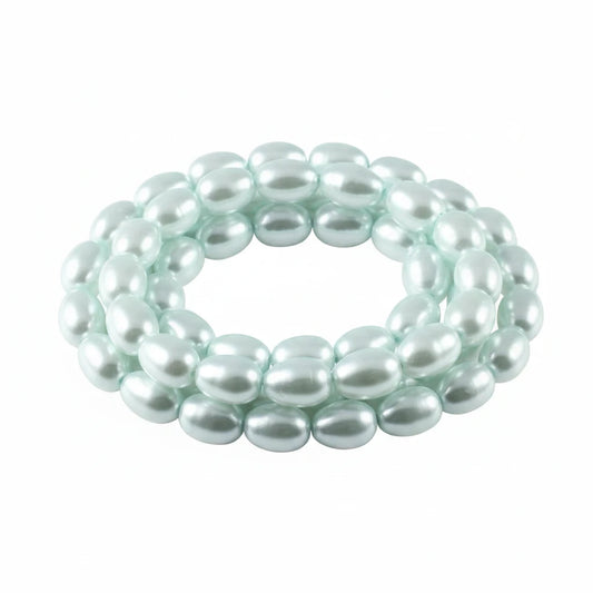 A strand of light aqua blue oval beads with a glossy, pearl-like finish, arranged in a loose circle on a plain white background.