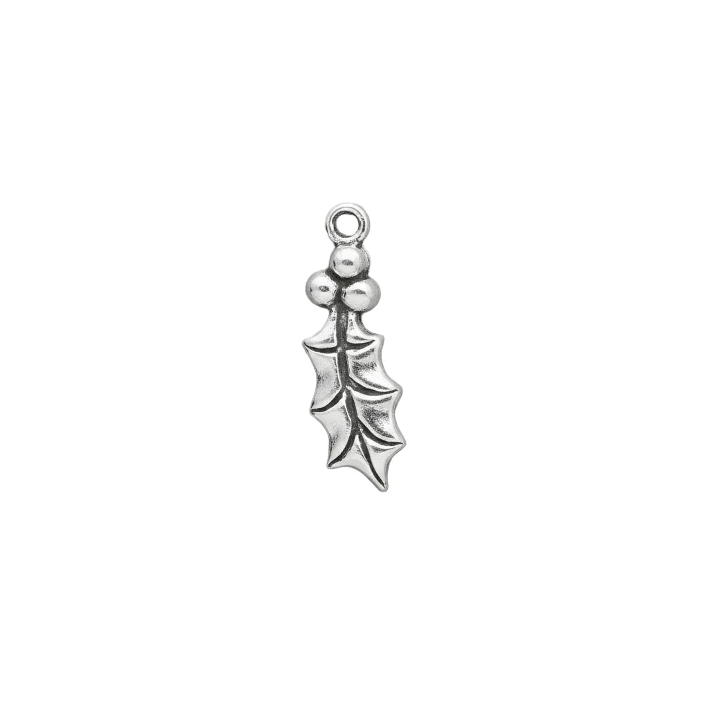 A small sterling silver holly leaf charm with three berries and a top loop, shown on a solid gray background.