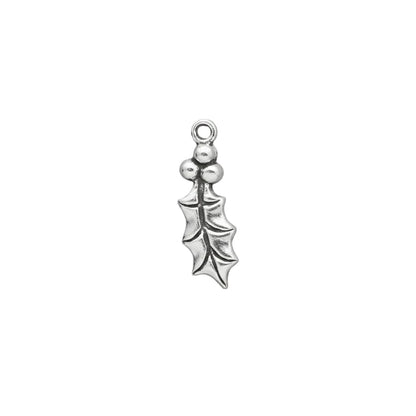 A small sterling silver holly leaf charm with three berries and a top loop, shown on a solid gray background.