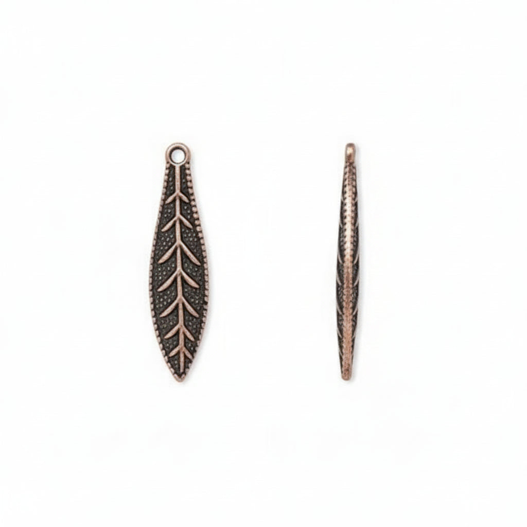 Two antique bronze leaf-shaped jewelry charms with detailed vein patterns, shown on a plain white background.