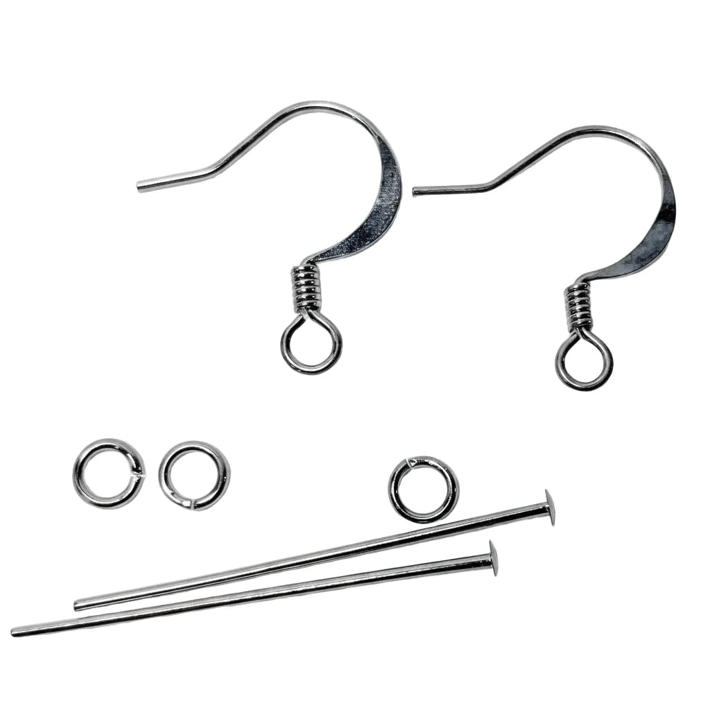 Two silver-tone fishhook ear wires with spring backings, shown with two jump rings and two short metal pins on a plain white background.