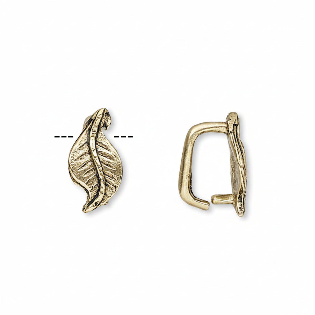 A pair of gold-toned metal ear cuffs shown on a plain white background, one displaying the front leaf-like design and the other showing the side profile.