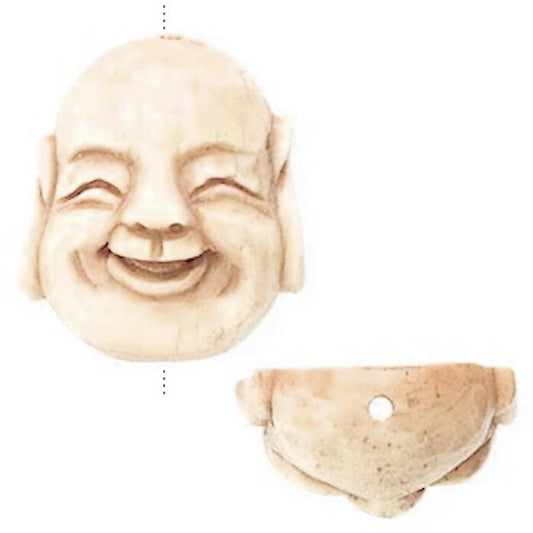 A carved smiling Buddha head ornament shown from two angles on a plain white background, with a small hole visible in the underside.