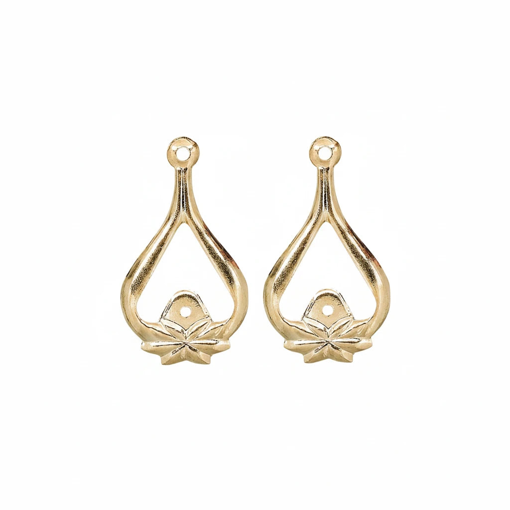 Two gold teardrop-shaped jewelry findings with a small flower detail at the bottom and a loop at the top, shown on a plain white background.