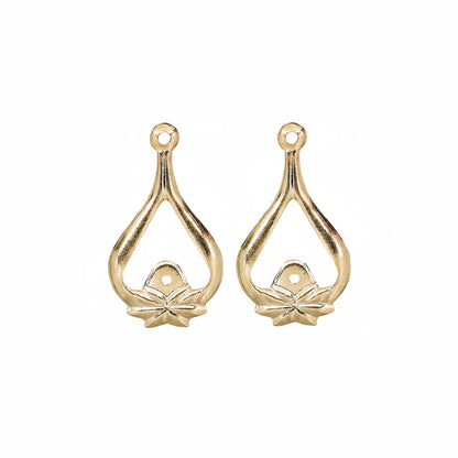 Two gold teardrop-shaped jewelry findings with a small flower detail at the bottom and a loop at the top, shown on a plain white background.