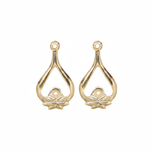Two gold teardrop-shaped jewelry findings with a small flower detail at the bottom and a loop at the top, shown on a plain white background.