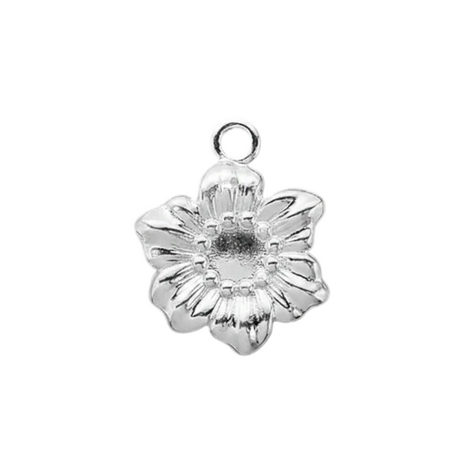 A silver flower-shaped jewelry charm with a textured center and a top loop, shown on a solid dark gray background.