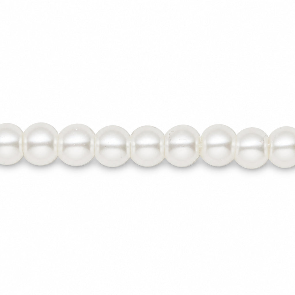 A close-up of a strand of white pearls aligned horizontally against a solid white background.