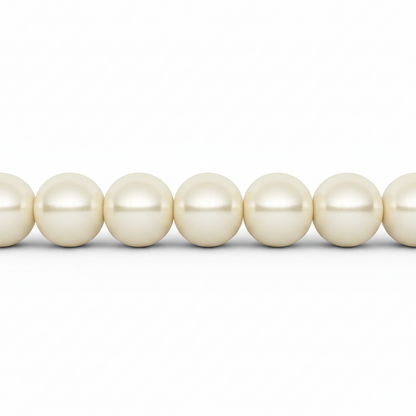 A close-up of a strand of creamy white freshwater pearls aligned horizontally against a solid white background.
